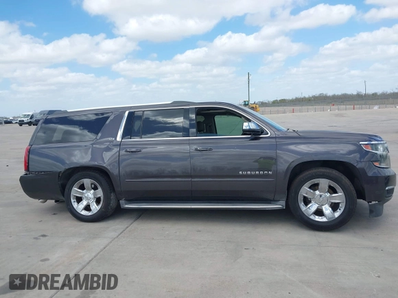 2015 Chevrolet Suburban LTZ with VIN 1GNSCKKC9FR500933, listed as a IAAI auction lot 41830980 with 169,217 mi miles and . Bid and sale history available at DreamBid. Image 12.