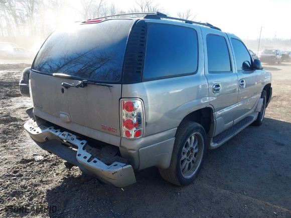 2005 GMC Yukon Denali with VIN 1GKEK63U45J192983, listed as a IAAI auction lot 41626897 with 294,072 mi miles. Bid and sale history available at carsss.com. Image 4.