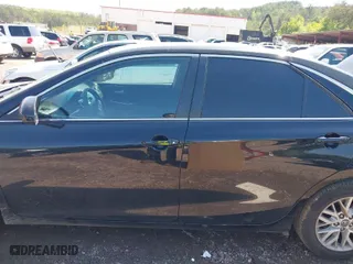 2016 Toyota Camry XLE with VIN 4T4BF1FK8GR584657, listed as a IAAI auction lot 41994436 with 212,401 mi miles. Bid and sale history available at carsss.com. Image 14.