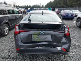 2021 Toyota Prius L Eco with VIN JTDKAMFU2M3143138, listed as a IAAI auction lot 41658263 with 102,718 mi miles. Bid and sale history available at carsss.com. Image 16.