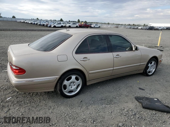 2001 Mercedes-Benz E-Class with VIN WDBJF70JX1B220786, listed as a Copart auction lot 71808344 with 94,476 mi miles and Salvage Title. Bid and sale history available at carsss.com. Image 3.