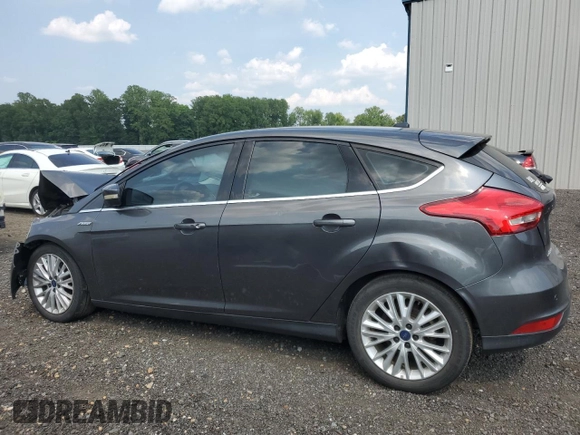 2018 Ford Focus Titanium z VIN 1FADP3N20JL271719, wystawiony jako Copart lot #60784755 z przebiegiem 116 118 mil mil oraz Szkoda całkowita • Salvage title. Historia ofert i sprzedaży dostępna na DreamBid. Obrazek 2.