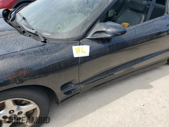 2000 Pontiac Firebird Formula z VIN 2G2FV22G9Y2140113, wystawiony jako Copart lot #76135324 z przebiegiem Nie podano mil oraz Szkoda całkowita • Salvage title. Historia ofert i sprzedaży dostępna na DreamBid. Obrazek 12.