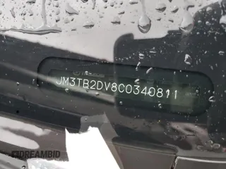 2012 Mazda CX-9 Grand Touring z VIN JM3TB2DV8C0340811, wystawiony jako Copart lot #56756905 z przebiegiem 102 972 mil mil oraz Szkoda całkowita • Salvage title. Historia ofert i sprzedaży dostępna na DreamBid. Obrazek 13.