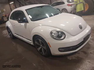 2012 Volkswagen Beetle 2.0T Turbo PZEV with VIN 3VWVA7AT4CM603293, listed as a IAAI auction lot 41633664 with 91,410 mi miles. Bid and sale history available at carsss.com. Image 1.