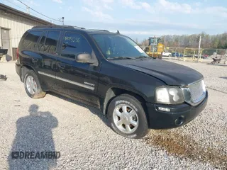 2006 GMC Envoy SLE with VIN 1GKDT13S262204960, listed as a IAAI auction lot 42045236 with 183,338 mi miles. Bid and sale history available at carsss.com. Image 1.