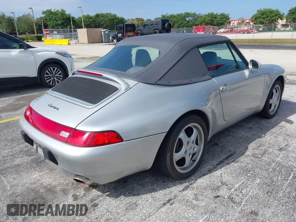 1998 Porsche 911 Carrera with VIN WP0CA2992WS340996, listed as a IAAI auction lot 42002177 with 47,222 mi miles. Bid and sale history available at carsss.com. Image 4.
