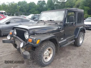2001 Jeep Wrangler Sahara with VIN 1J4FA59S41P358035, listed as a IAAI auction lot 42685488 with 120,630 mi miles and . Bid and sale history available at DreamBid. Image 2.