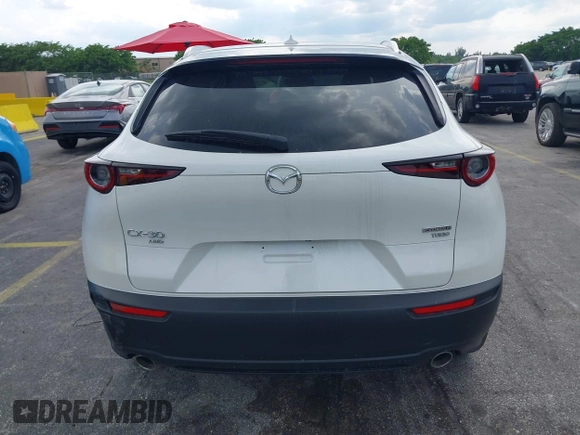 2024 Mazda CX-30 Premium z VIN 3MVDMBDY7RM706554, wystawiony jako IAAI lot #42322863 z przebiegiem 2817 mil mil oraz . Historia ofert i sprzedaży dostępna na DreamBid. Obrazek 16.