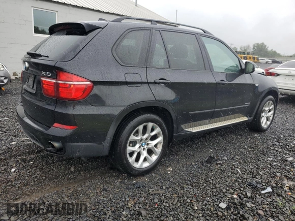 2012 BMW X5 35i with VIN 5UXZV4C57CL765053, listed as a Copart auction lot 59997275 with 157,943 mi miles and Salvage title. Bid and sale history available at DreamBid. Image 3.