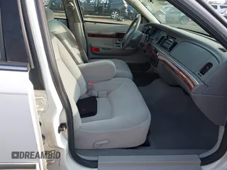 2002 Mercury Grand Marquis GS z VIN 2MEFM74W12X630926, wystawiony jako IAAI lot #42480472 z przebiegiem 58 884 mil mil oraz . Historia ofert i sprzedaży dostępna na DreamBid. Obrazek 5.