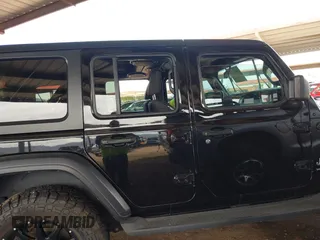 2019 Jeep Wrangler Unlimited Sport S with VIN 1C4HJXDN2KW630780, listed as a IAAI auction lot 41817573 with 56,113 mi miles. Bid and sale history available at carsss.com. Image 13.