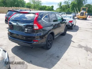 2015 Honda CR-V LX with VIN 2HKRM4H38FH601802, listed as a IAAI auction lot 42177101 with 71,775 mi miles and . Bid and sale history available at DreamBid. Image 4.