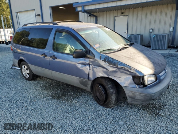 1999 Toyota Sienna LE with VIN 4T3ZF13C8XU108650, listed as a Copart auction lot 74476004 with 215,060 mi miles and Salvage Title. Bid and sale history available at carsss.com. Image 4.