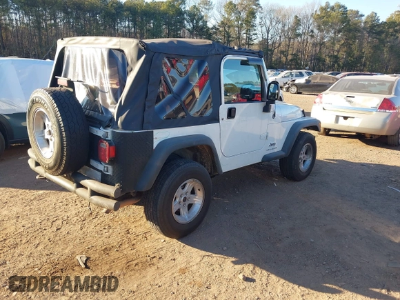 2004 Jeep Wrangler Sport Right Hand Drive with VIN 1J4F449S74P732854, listed as a IAAI auction lot 41408316 with 112,064 mi miles. Bid and sale history available at carsss.com. Image 4.