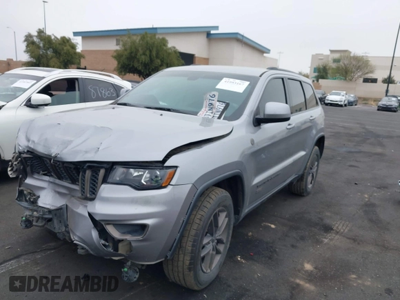 2016 Jeep Grand Cherokee Laredo z VIN 1C4RJFAG3GC457431, wystawiony jako IAAI lot #41993167 z przebiegiem 61 427 mil mil oraz . Historia ofert i sprzedaży dostępna na DreamBid. Obrazek 19.