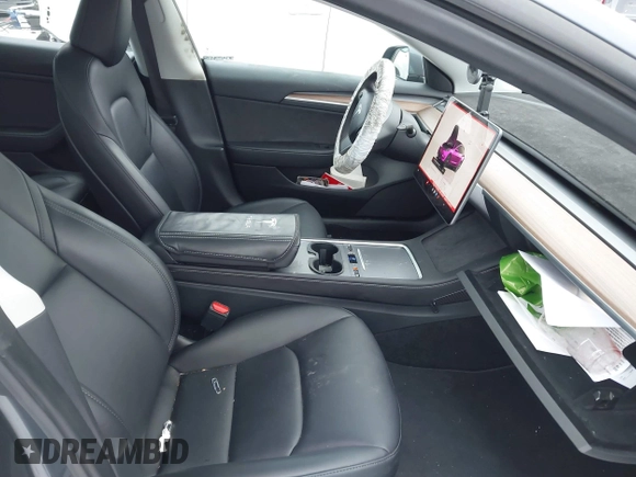2023 Tesla Model 3 Long Range with VIN 5YJ3E1EBXPF708122, listed as a IAAI auction lot 41185314 with 27,765 mi miles and . Bid and sale history available at DreamBid. Image 5.