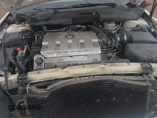 2002 Cadillac DeVille DHS z VIN 1G6KE57YX2U212020, wystawiony jako IAAI lot #41287342 z przebiegiem Nie podano mil oraz . Historia ofert i sprzedaży dostępna na DreamBid. Obrazek 10.