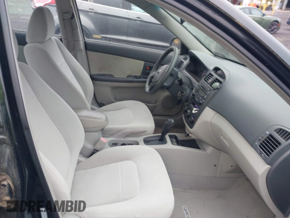 2005 Kia Spectra LX z VIN KNAFE121355138257, wystawiony jako IAAI lot #42323008 z przebiegiem 164 869 mil mil oraz . Historia ofert i sprzedaży dostępna na DreamBid. Obrazek 5.