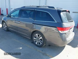 2014 Honda Odyssey Touring with VIN 5FNRL5H97EB101169, listed as a IAAI auction lot 41869233 with 142,147 mi miles and . Bid and sale history available at DreamBid. Image 3.