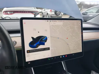 2019 Tesla Model 3 Mid Range with VIN 5YJ3E1EA5KF299589, listed as a IAAI auction lot 41709733 with 50,256 mi miles and . Bid and sale history available at DreamBid. Image 19.