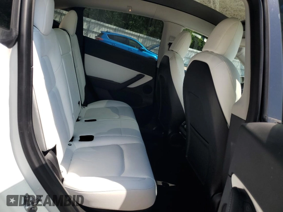 2022 Tesla Model Y Long Range z VIN 7SAYGDEE1NF354633, wystawiony jako Copart lot #55221835 z przebiegiem 53 821 mil mil oraz Szkoda całkowita • Salvage title. Historia ofert i sprzedaży dostępna na DreamBid. Obrazek 10.