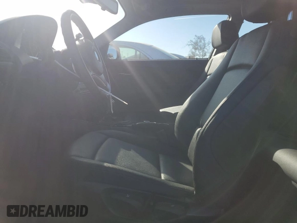2010 BMW 1 Series 128i with VIN WBAUP9C54AVL89302, listed as a Copart auction lot 76716114 with 65,882 mi miles and Salvage Title. Bid and sale history available at DreamBid. Image 7.