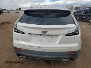 2022 Cadillac XT4 FWD Sport z VIN 1GYFZER47NF165920, wystawiony jako Copart lot #50389935 z przebiegiem 57 410 mil mil oraz Szkoda całkowita • Salvage title. Historia ofert i sprzedaży dostępna na DreamBid. Obrazek 6.
