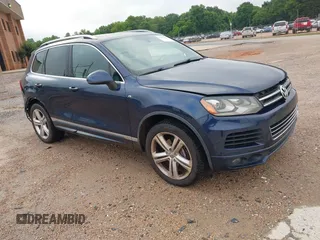 2014 Volkswagen Touareg R-Line with VIN WVGDF9BP8ED015095, listed as a IAAI auction lot 42356380 with 112,849 mi miles and . Bid and sale history available at DreamBid. Image 1.