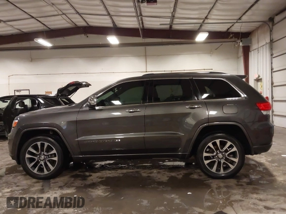 2017 Jeep Grand Cherokee Overland z VIN 1C4RJFCG6HC641812, wystawiony jako IAAI lot #42053404 z przebiegiem 129 184 mil mil oraz . Historia ofert i sprzedaży dostępna na DreamBid. Obrazek 14.