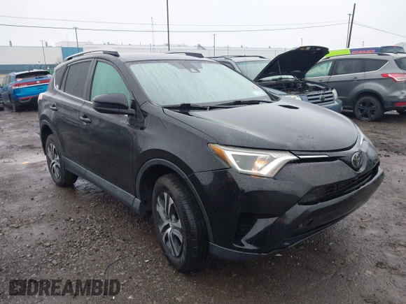 2018 Toyota RAV4 LE with VIN 2T3BFREV2JW788700, listed as a IAAI auction lot 41986212 with 87,704 mi miles. Bid and sale history available at carsss.com. Image 6.