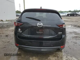2018 Mazda CX-5 Touring z VIN JM3KFBCM4J0377280, wystawiony jako Copart lot #56688575 z przebiegiem 101 167 mil mil oraz Czysty tytuł • Clean title. Historia ofert i sprzedaży dostępna na DreamBid. Obrazek 6.