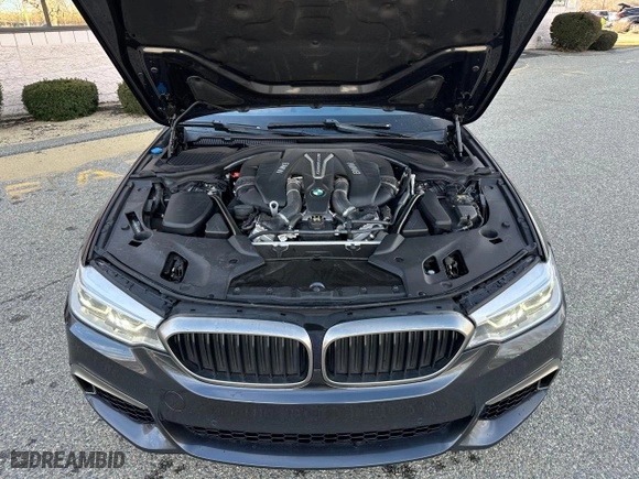 2018 BMW 5 Series M550i xDrive with VIN WBAJB9C53JB049688, listed as a Copart auction lot 48824465 with 127,200 mi miles and Clean Title. Bid and sale history available at carsss.com. Image 7.