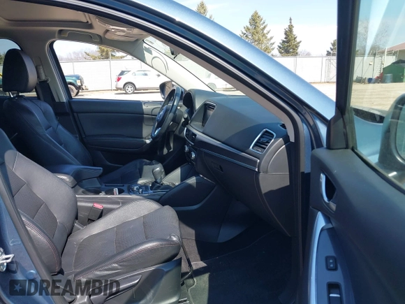 2016 Mazda CX-5 Grand Touring z VIN JM3KE4DY6G0785255, wystawiony jako IAAI lot #41887066 z przebiegiem 171 334 mil mil oraz . Historia ofert i sprzedaży dostępna na DreamBid. Obrazek 5.