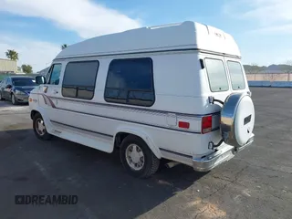 1995 Chevrolet Chevy Van z VIN 1GBEG25K5SF131291, wystawiony jako IAAI lot #41861888 z przebiegiem 90 365 mil mil oraz . Historia ofert i sprzedaży dostępna na DreamBid. Obrazek 3.