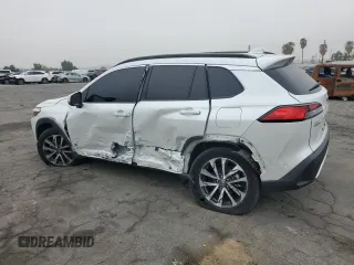 2022 Toyota Corolla Cross XLE with VIN 7MUDAAAG6NV014706, listed as a Copart auction lot 52456065 with 31,041 mi miles and Salvage title. Bid and sale history available at DreamBid. Image 2.