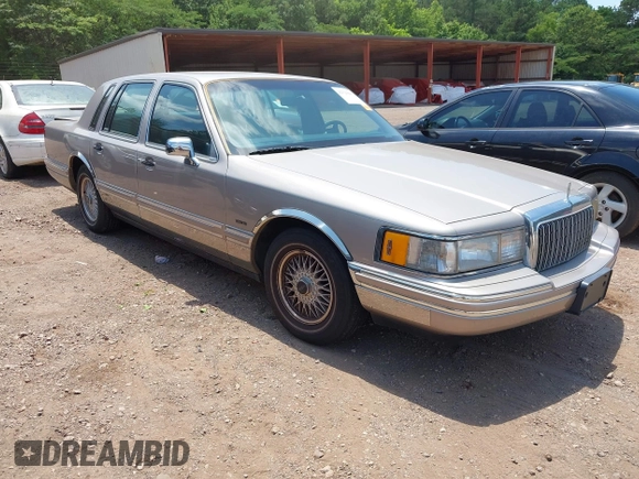 1994 Lincoln Town Car Signature z VIN 1LNLM82W2RY628475, wystawiony jako IAAI lot #42320445 z przebiegiem 107 346 mil mil oraz . Historia ofert i sprzedaży dostępna na DreamBid. Obrazek 1.