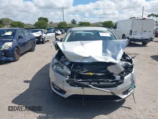 2018 Ford Focus SE z VIN 1FADP3FE3JL220529, wystawiony jako IAAI lot #41564216 z przebiegiem 16 883 mil mil oraz . Historia ofert i sprzedaży dostępna na DreamBid. Obrazek 12.