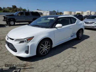 2014 Scion tC z VIN JTKJF5C71E3082375, wystawiony jako Copart lot #56909095 z przebiegiem 140 165 mil mil oraz Szkody całkowita. Historia ofert i sprzedaży dostępna na DreamBid. Obrazek 1.