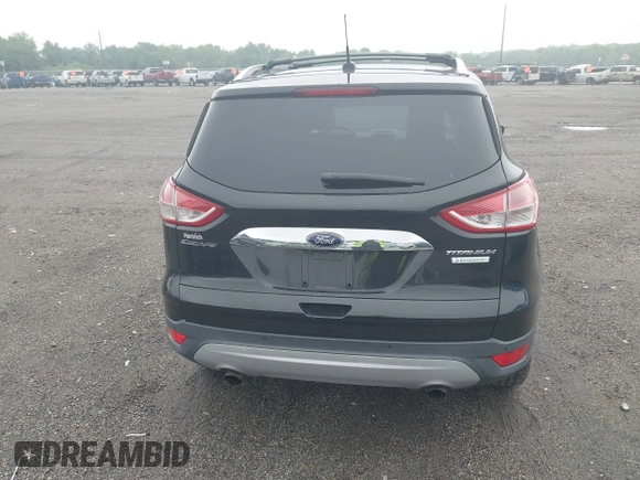 2015 Ford Escape Titanium z VIN 1FMCU0JX7FUB00462, wystawiony jako IAAI lot #42532943 z przebiegiem 88 623 mil mil oraz . Historia ofert i sprzedaży dostępna na DreamBid. Obrazek 16.