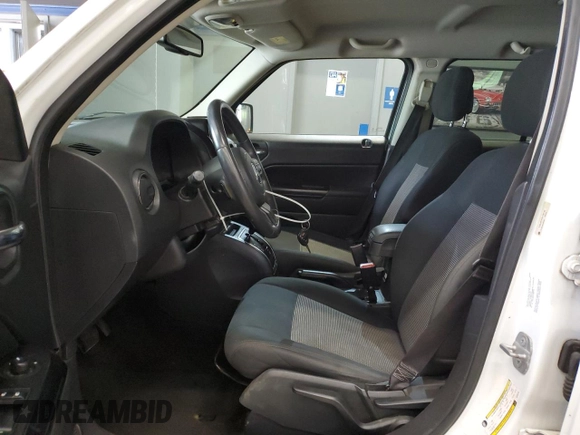 2014 Jeep Patriot Latitude with VIN 1C4NJRFB3ED766143, listed as a Copart auction lot 57879215 with 145,733 mi miles and Clean title. Bid and sale history available at DreamBid. Image 7.