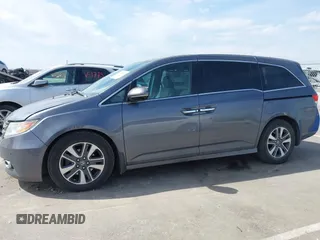 2014 Honda Odyssey Touring with VIN 5FNRL5H91EB093540, listed as a IAAI auction lot 41887412 with 202,076 mi miles and . Bid and sale history available at DreamBid. Image 14.