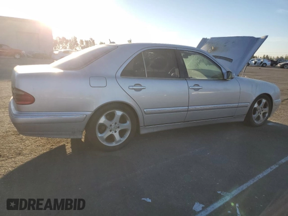 2002 Mercedes-Benz E-Class with VIN WDBJF65J32B496411, listed as a Copart auction lot 75690884 with 128,855 mi miles and Salvage Title. Bid and sale history available at carsss.com. Image 3.
