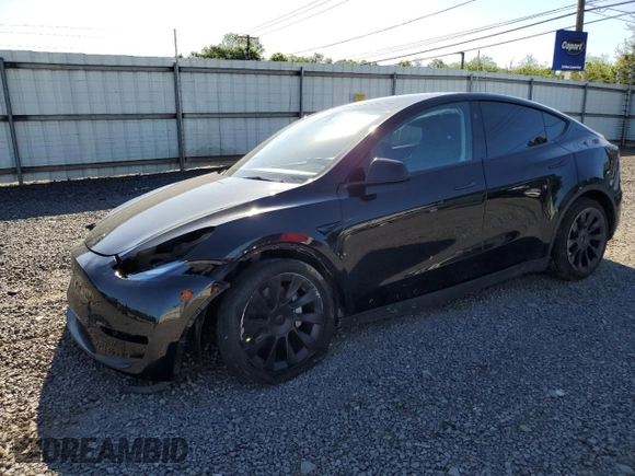 2023 Tesla Model Y Long Range z VIN 7SAYGDEE1PF865195, wystawiony jako Copart lot #57455765 z przebiegiem 32 011 mil mil oraz Szkoda całkowita • Salvage title. Historia ofert i sprzedaży dostępna na DreamBid. Obrazek 1.