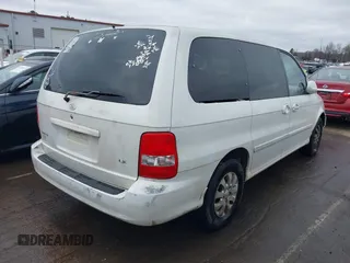 2004 Kia Sedona LX with VIN KNDUP131446537660, listed as a IAAI auction lot 41526183 with 282,891 mi miles. Bid and sale history available at carsss.com. Image 4.