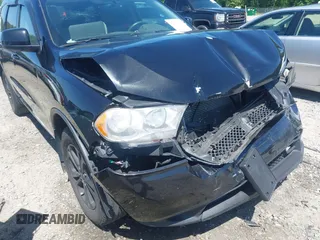 2013 Dodge Durango SXT with VIN 1C4RDJAG8DC617759, listed as a IAAI auction lot 42113300 with 185,152 mi miles and . Bid and sale history available at DreamBid. Image 17.