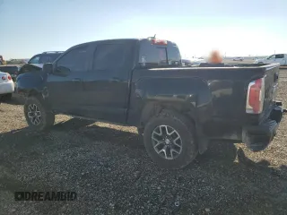 2021 GMC Canyon 4WD AT4 w/Leather with VIN 1GTG6FEN3M1274409, listed as a Copart auction lot 42502355 with 57,194 mi miles and Salvage Title. Bid and sale history available at carsss.com. Image 2.