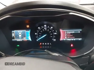 2019 Ford Fusion Hybrid SE with VIN 3FA6P0LUXKR205712, listed as a IAAI auction lot 41267049 with 124,687 mi miles. Bid and sale history available at carsss.com. Image 7.
