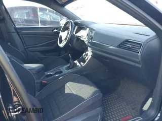 2019 Volkswagen Jetta GLI S z VIN 3VW5T7BU1KM156888, wystawiony jako IAAI lot #40778065 z przebiegiem 97 114 mil mil oraz . Historia ofert i sprzedaży dostępna na DreamBid. Obrazek 5.