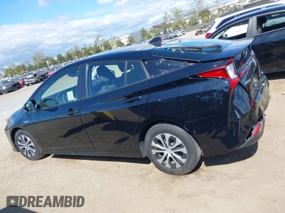 2021 Toyota Prius L Eco with VIN JTDKAMFU6M3135799, listed as a IAAI auction lot 42064241 with 77,120 mi miles and . Bid and sale history available at DreamBid. Image 14.